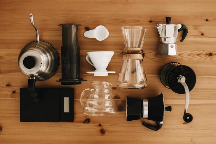 alternative coffee brewing method set flat lay stylish accessories items alternative coffee wooden table kettle scales geyser grinder aeropress pour glass flask top view 250813 5932